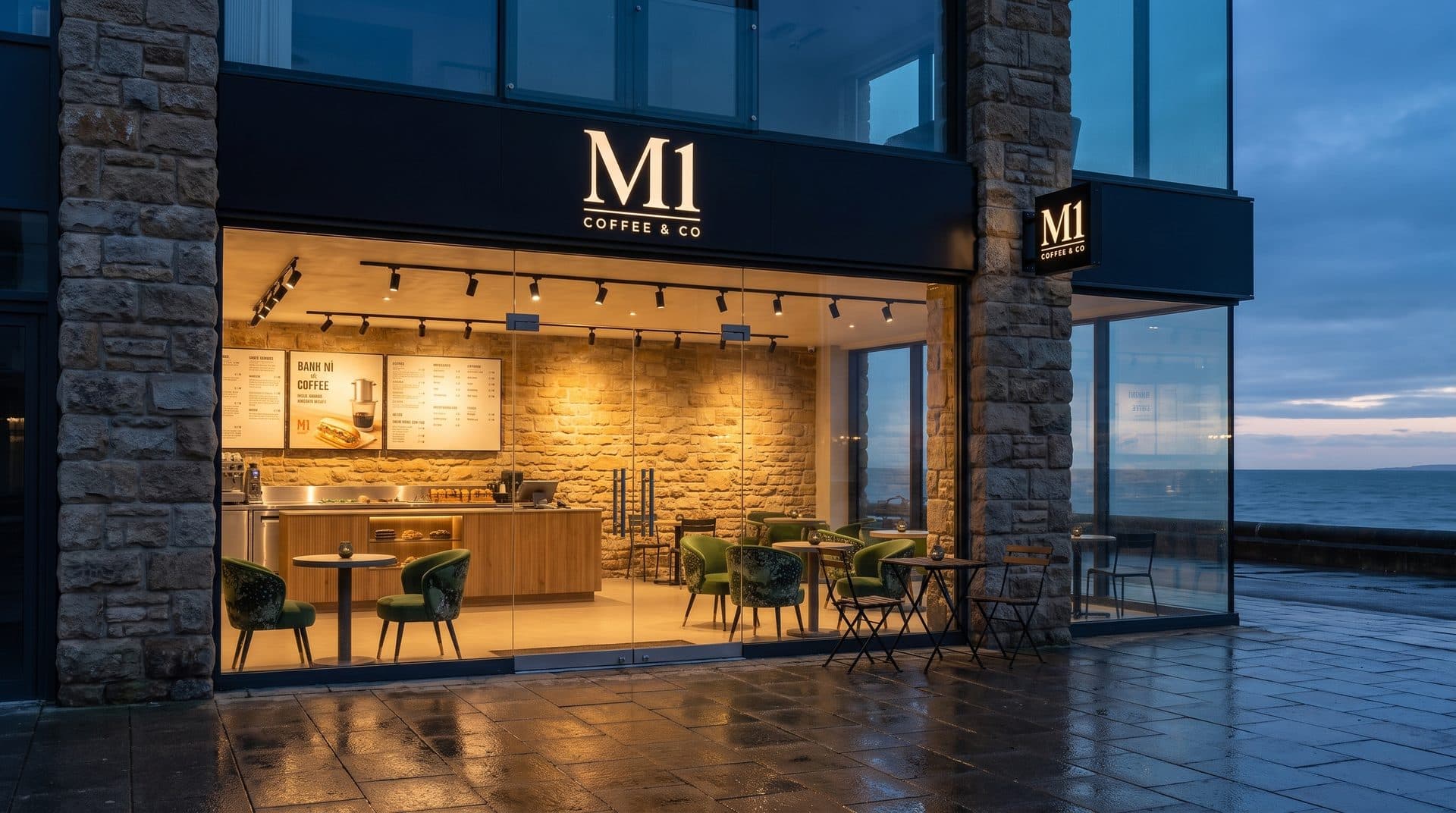 The M1 Coffee & Co frontage at dusk on the New Brighton promenade, lit from inside